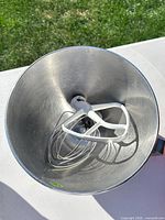 Top view of bowl with paddle and whisk inside