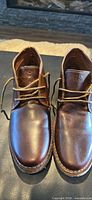 Top view of brown leather boots showing uppers and laces