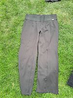 Olive pull-on stretch pants laid flat