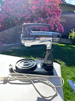 Side view of Sunbeam Mixmaster on stand with power cord visible