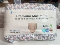 Front view of sealed package showing brand, product name, absorbency level, count, size, and color