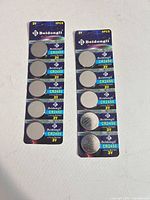Front view of two unopened Beidongli CR2450 battery blister packs