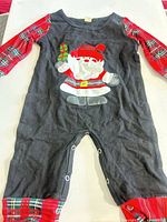 Full front view of romper laid flat showing overall design