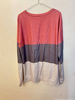 Front view of colorblock long sleeve shirt on hanger