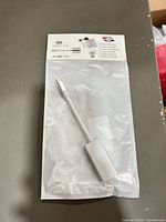 Front of sealed package showing silver USB-C to HDMI adapter