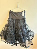 Full view of skirt showing elastic waistband and layered ruffles