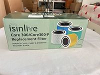 Front of box showing iSinlive Core 300/Core300-P Replacement Filter, replace cycle note and 2-pack indication