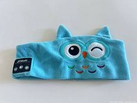 Front view showing owl embroidery and JY Music control panel