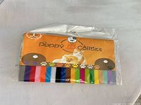 Front of sealed pack showing Puppy ID Collars label and 12 color samples