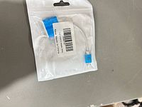 Front view of sealed bag showing adapter inside