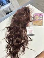wig with tags and packaged wig cap