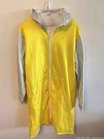 Front view of zipped yellow and gray hoodie
