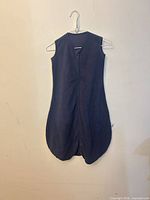 Full view front of navy sleep sack on hanger