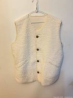 Front view showing buttons, pockets, texture