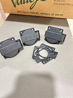 Front view of three covered receptacles with gaskets