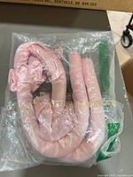 Front view of sealed package showing pink rolled extension