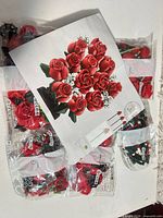 Front view of sealed plastic bags and instruction sheet for rose bouquet set