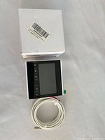 Thermostat front view with cable and box