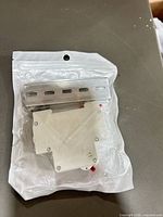 Front view of sealed pouch showing breaker and DIN rail