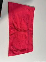 Front view of hot pink seamless bandeau bra top