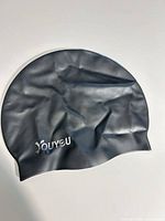 Front view of black YouYou silicone swim cap