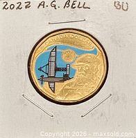 Reverse of 2022 colourized Alexander Graham Bell loonie in 2x2 holder