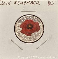 Coin in 2×2 holder showing coloured poppy reverse