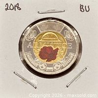 Reverse of coin in holder showing colourized design