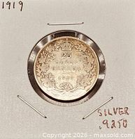 Reverse of 1919 Canadian 25 cent silver coin in holder
