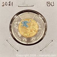 Full view of coin in holder showing reverse design and date