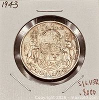 Reverse of 1943 Canadian 50-cent coin showing coat of arms
