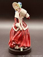 Front view of Royal Doulton Christmas Morn figurine on stand