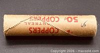 Side view of sealed roll with “COPPERS 50¢” print