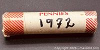 Side view of paper-wrapped roll marked PENNIES and 1972