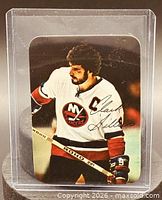 Front of Clark Gillies glossy insert card in protective holder