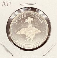 Obverse of 1977 Jasper souvenir dollar in 2×2 holder
