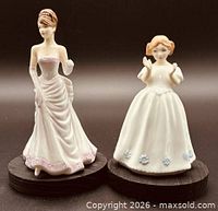 Front view of both Royal Doulton figurines on display bases