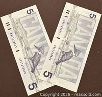 Reverse sides showing belted kingfisher and serial numbers