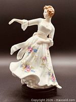 Front view of Royal Doulton Hazel figurine showing floral dress and pose