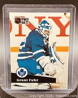 Front of Grant Fuhr Pro Set card showing action image, logos and name