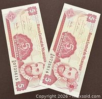 Fronts of two consecutive 5 Centavos notes showing denomination, portrait, serials