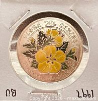 Reverse of coin with colored Marilope flower design and text 'FLORA DEL CARIBE'