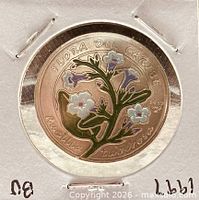 Reverse of coin showing Ruellia tuberosa flower design and year 1997