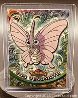 Front of Venomoth card in holder showing foil artwork and number 49