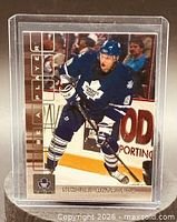 Front of trading card showing Nikolai Antropov skating in Toronto Maple Leafs uniform