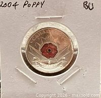 Reverse side showing coloured red poppy design and denomination
