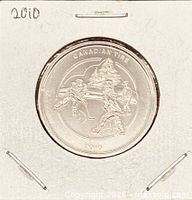 Obverse of 2010 Canadian Tire hockey trade dollar in flip
