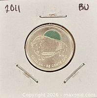 Obverse side showing coloured wood bison design and date