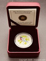 Coin in open burgundy RCM clamshell presentation case with insert card