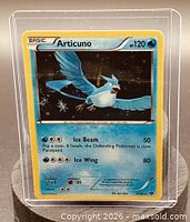 Front of Articuno card in holder showing artwork, stats and set info